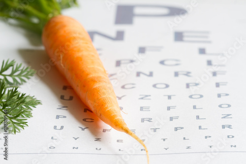 Carrot vitamin A and eye test chart healt medical  concept
