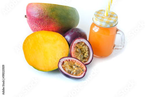 mango and passion fruit juice in a glass jar. Isolate photo