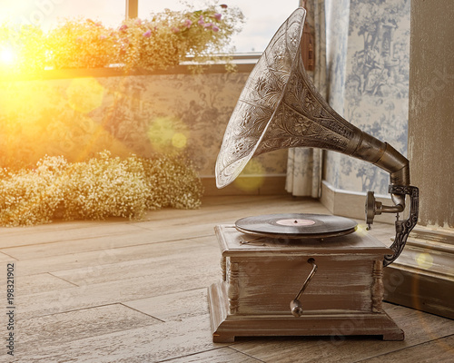 Beautiful silver vintage phonograph. Retro gramophone with copy space. Toned.