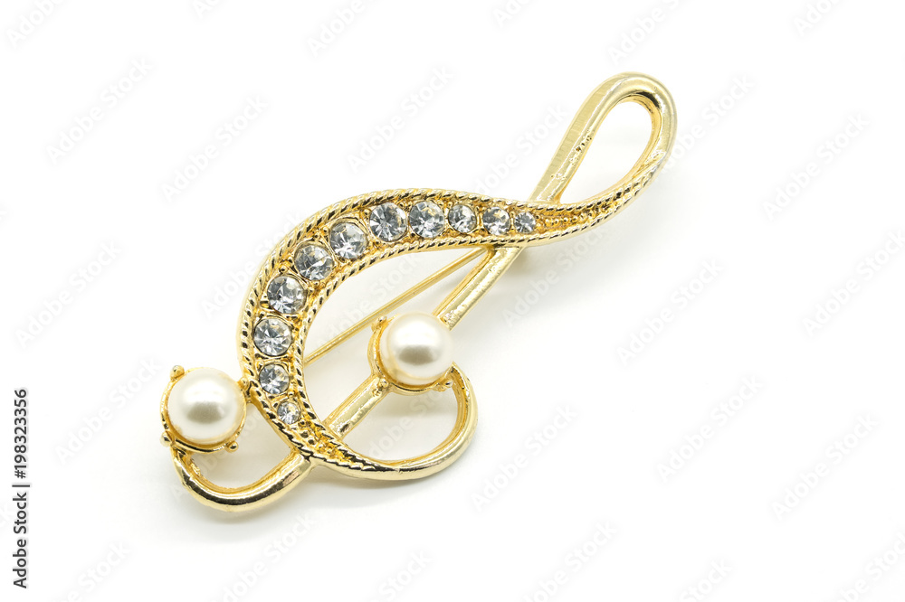 Antique Gold clef Broach on White Background Antique Gold clef Broach on White Background