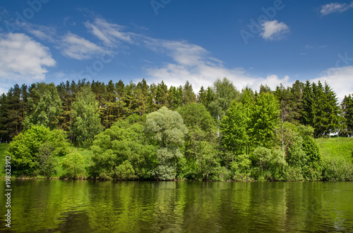 The lake is surrounded by trees along the banks