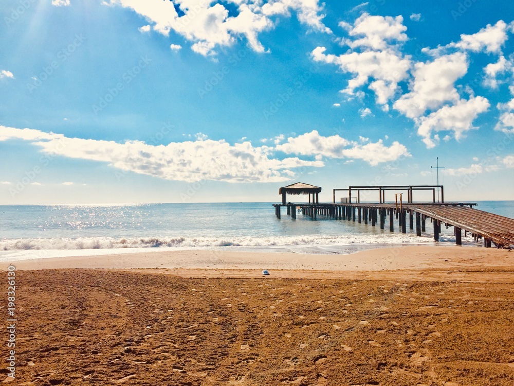 Fototapeta premium Wooden pier in Newport Beach,landscape green blue.