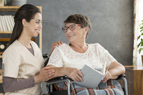 Woman in wheelchair with nurse