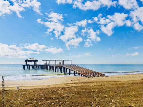 Wooden pier in Newport Beach,landscape green blue. © ala