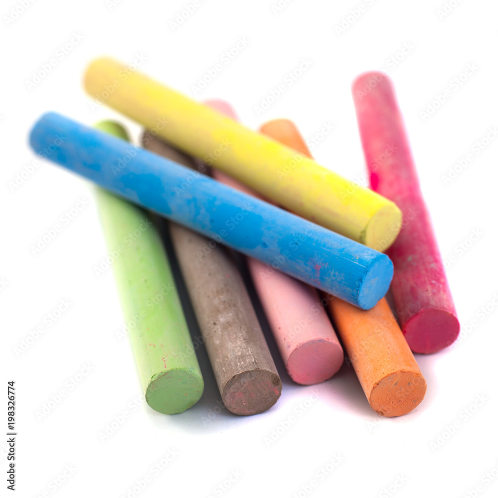 Colored chalks on white background with soft shadows Colored chalks on white background with soft shadows