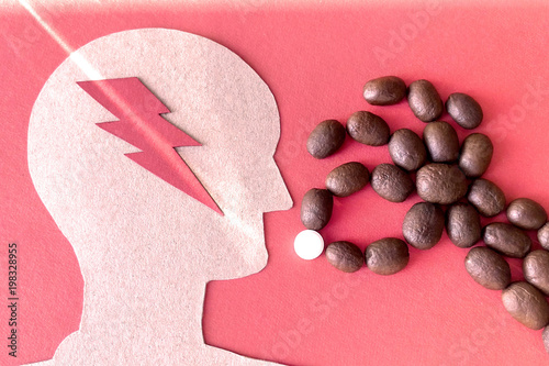 Image of a man made of cardboard red background lightning beam hand made of coffee beans with pills sign dependence on caffeine and stimulating photo