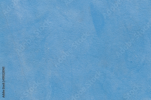 Blue concrete background.
