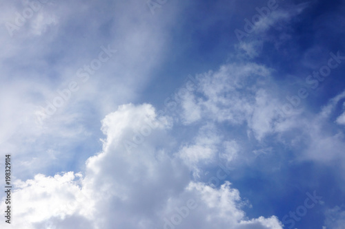 texture of a bright blue sky with a large cloud