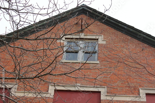 Exterior of old brick abandoned historical mental asylum facility © Alex