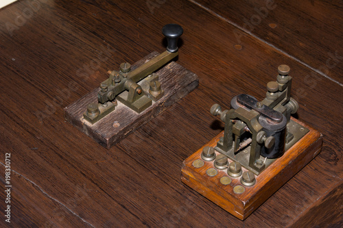The old telegraph on wooden table