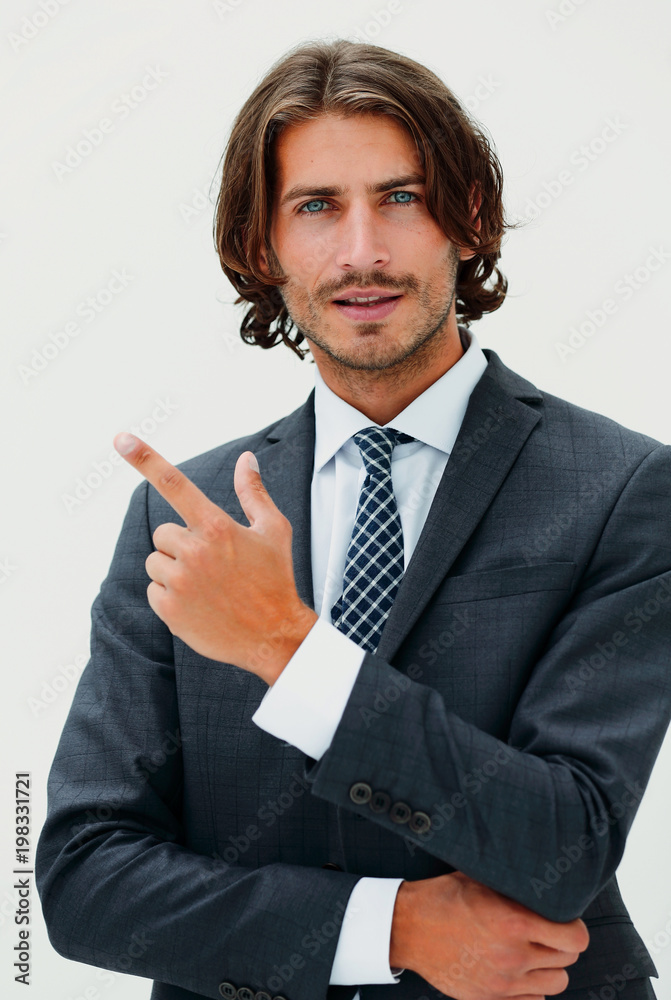 a young and handsome businessman pointing up with his finger a young and handsome businessman pointing up with his finger