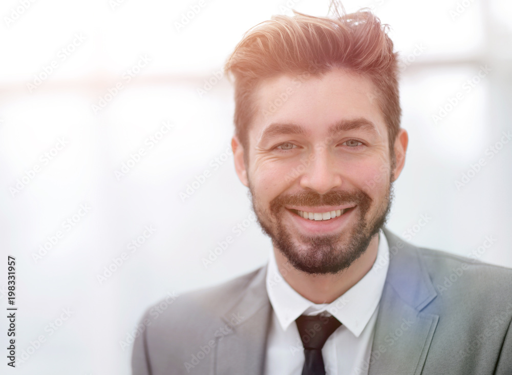 Happy young man in suit looking at camera with toothy smile Happy young man in suit looking at camera with toothy smile