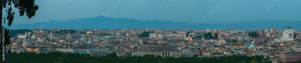 Twilight dusk urban skyline panorama of Rome with main architectural international landmarks from Janiculum hill viewpoint with famous Pantheon and Altare della Patria buildings