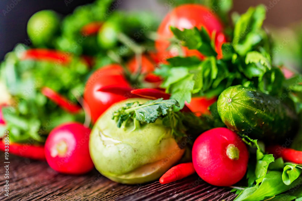 Fresh vegetables and herbs on wooden table Fresh vegetables and herbs on wooden table