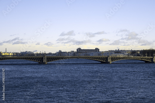View of the beautiful city of St. Petersburg, the Neva River, the bridge and the beautiful sky. © Anatasia