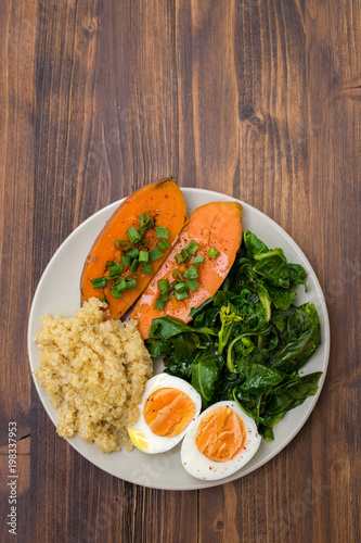 sweet potato with quinoa, boiled egg on plate