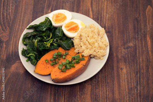 sweet potato with quinoa, boiled egg on plate