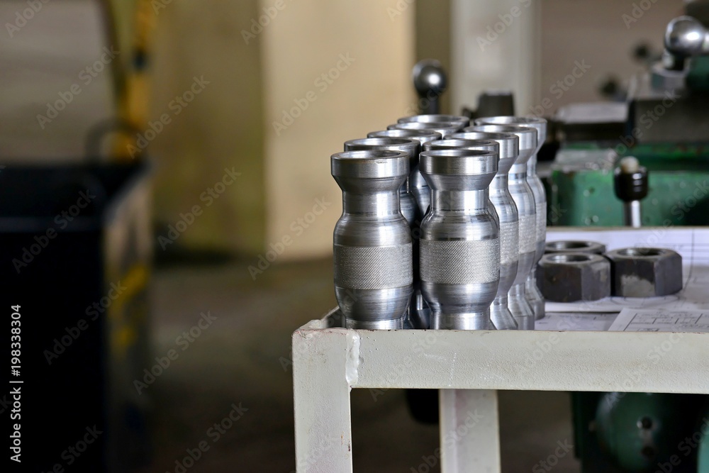 Metal part with a notch after turning on a rack near the machine