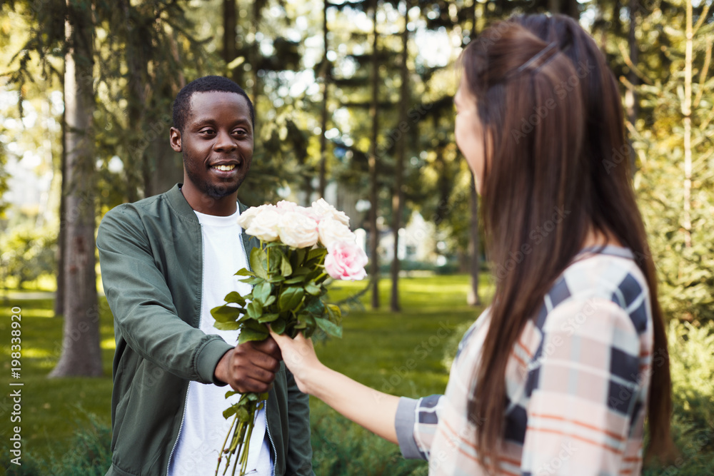 Man giving flowers for his beautiful girlfriend