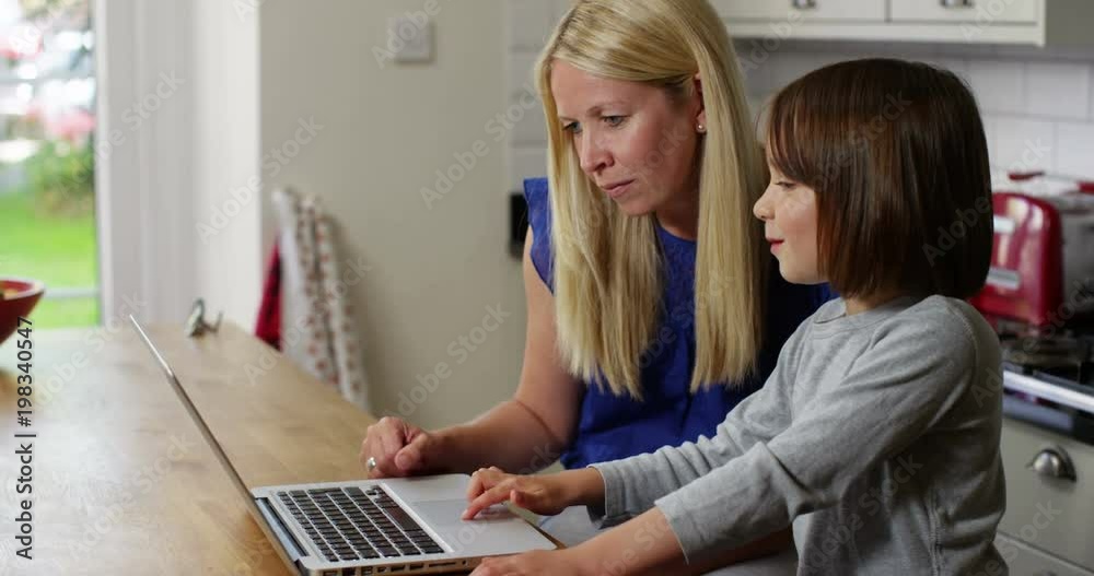 Mother and daughter on a laptop Mother and daughter on a laptop