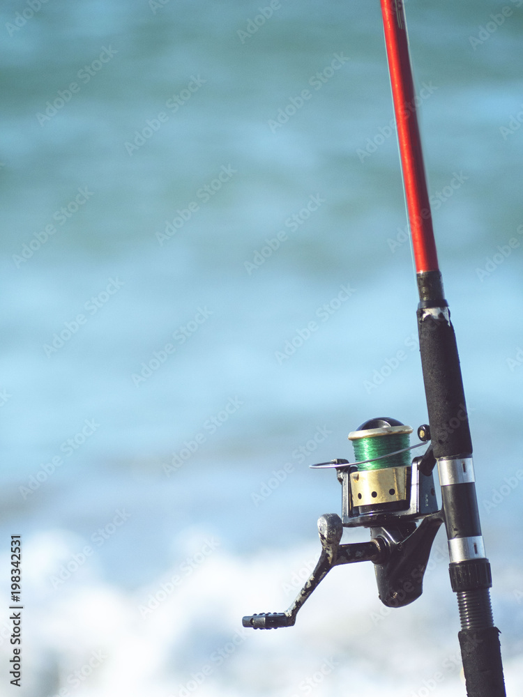 Fishing rod, spinning, reel, close-up, sea