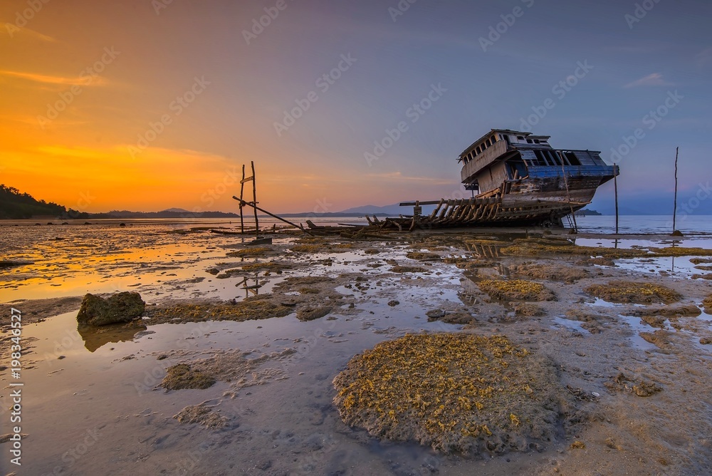 Sunset with broken ship riau island Indonesia Sunset with broken ship riau island Indonesia