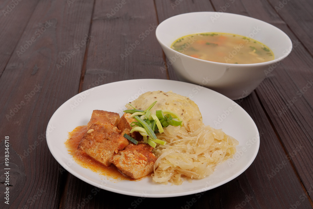 Tofu with cabbage and rice dumplings on a table Tofu with cabbage and rice dumplings on a table