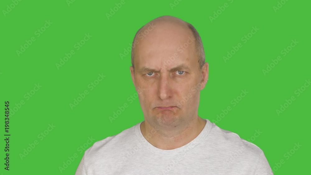 Mature angry man looking at camera. Alpha channel, keyed green screen . Mature angry man looking at camera. Alpha channel, keyed green screen .