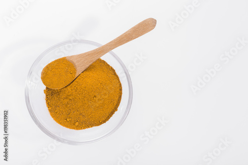 turmeric powder in container - curcuma longa
