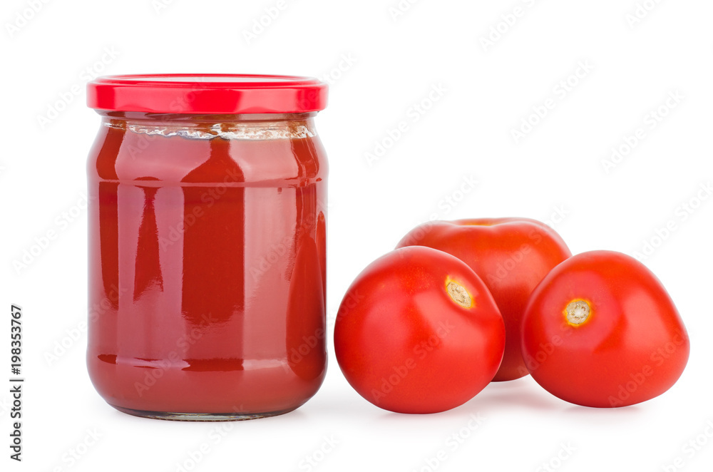 Glass jar with tomato paste and tomatoes Glass jar with tomato paste and tomatoes