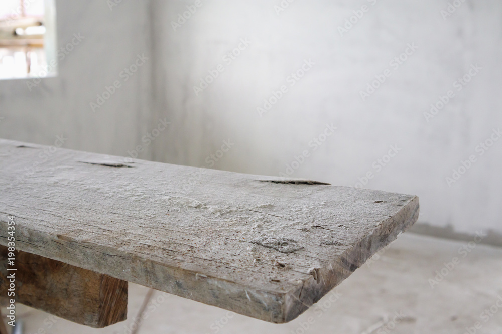 empty wood table at house building construction site empty wood table at house building construction site