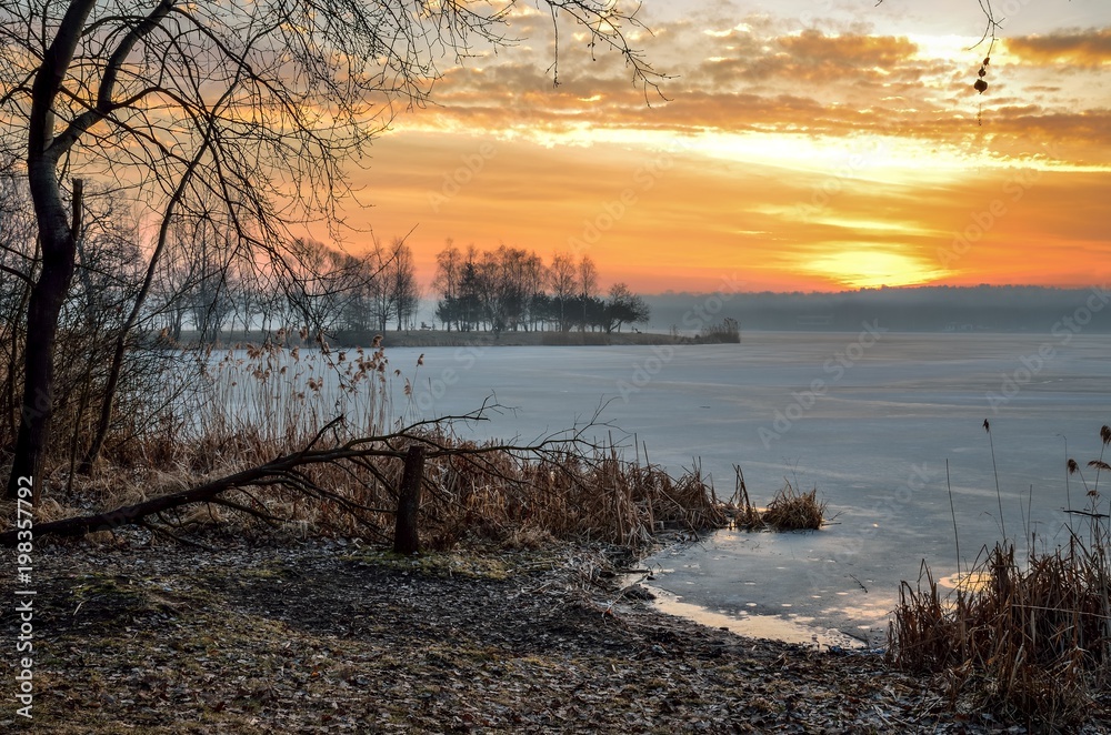 Beautiful winter sunrise. A frosty morning by the lake. Beautiful winter sunrise. A frosty morning by the lake.