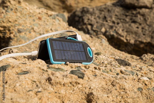 the solar panel for a campaign charges phone
