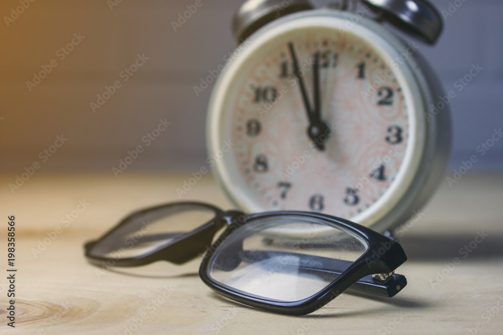 glasses and alarm clock glasses and alarm clock