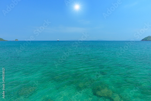 Blue sea and blue sky with sun