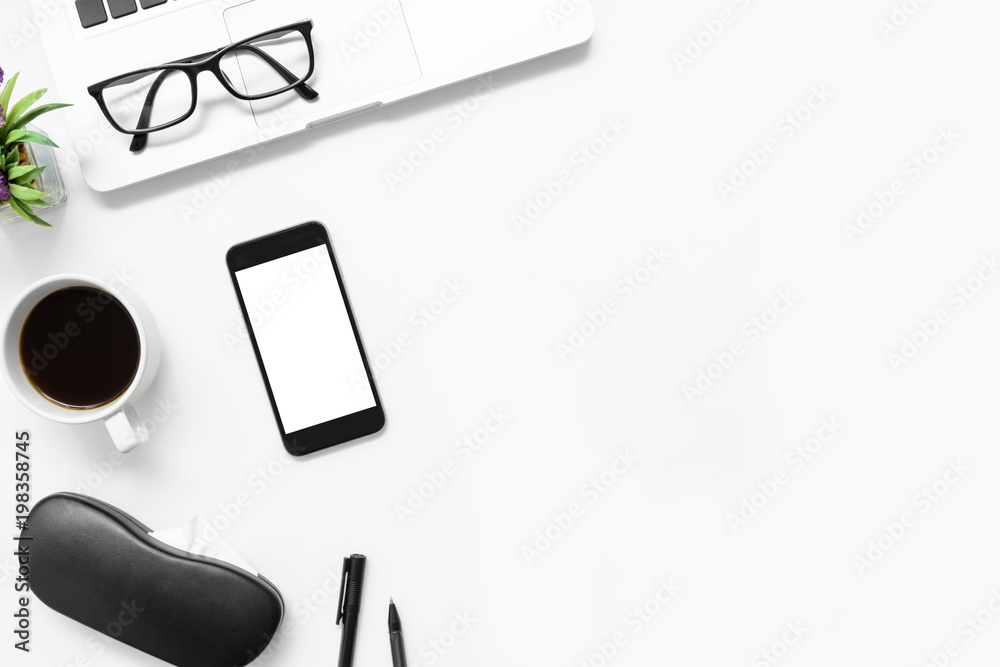 White office desk table with smartphone with blank screen and other office supplies. Top view with copy space, flat lay.