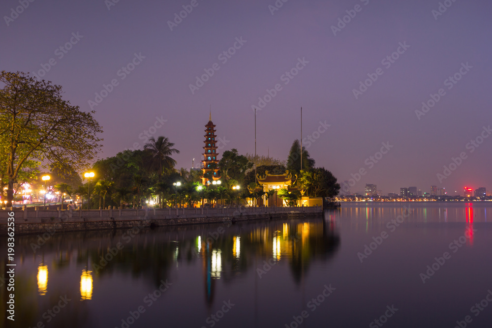 Beautiful night view of the Tran Quoc Pagoda on the small peninsula (The most ancient pagoda in Hanoi, originally constructed in the 6th century), East side of West Lake, Hanoi, Vietnam
