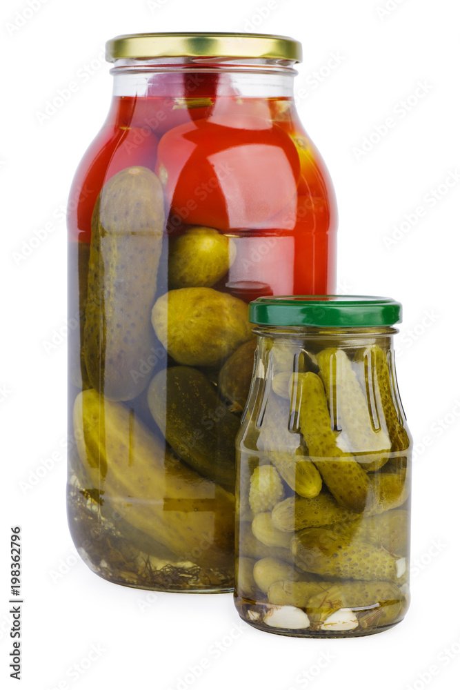 Glass jars with pickled tomatoes and cucumbers Glass jars with pickled tomatoes and cucumbers