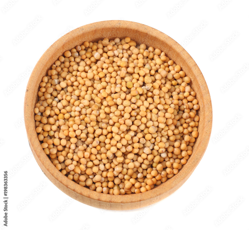 mustard seeds in wooden bowl isolated on white background. top view mustard seeds in wooden bowl isolated on white background. top view