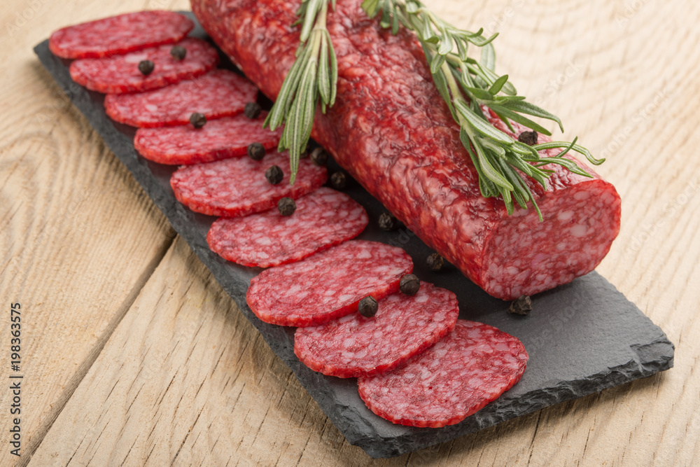 Sausage with salami with rosemary. Macro Sausage with salami with rosemary. Macro