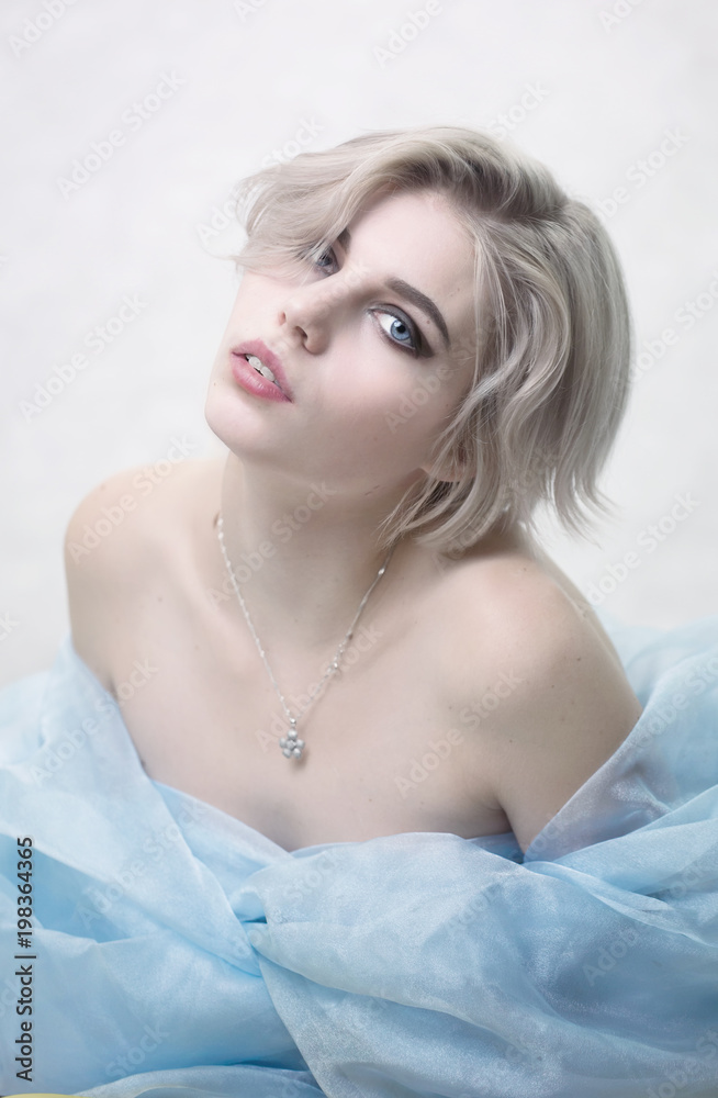 Glamorous tender portrait of young girl in blue veilt Glamorous tender portrait of young girl in blue veilt