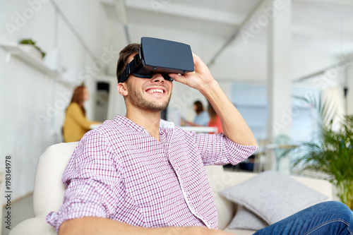 technology, augmented reality and people concept - happy man with virtual headset at office