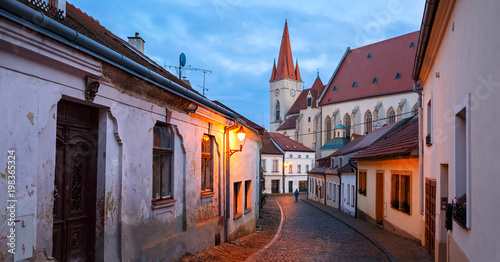 Panoramic view of the old paved street in the historical downtown on a winter evening. Town of Znojmo, Czech Republic.