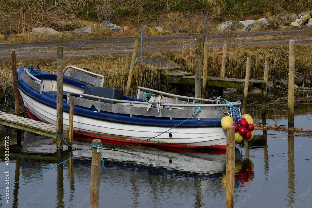 Obraz premium Colorful boat in danish harbor