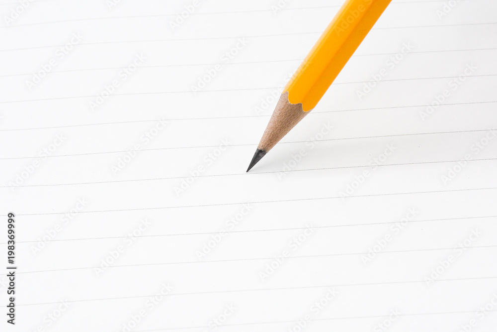 close up of pencil writing on a paper - for business concept close up of pencil writing on a paper - for business concept