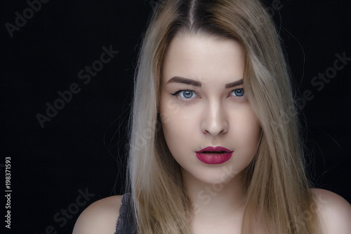 beauty, make up and people concept - happy laughing young woman with red lipstick