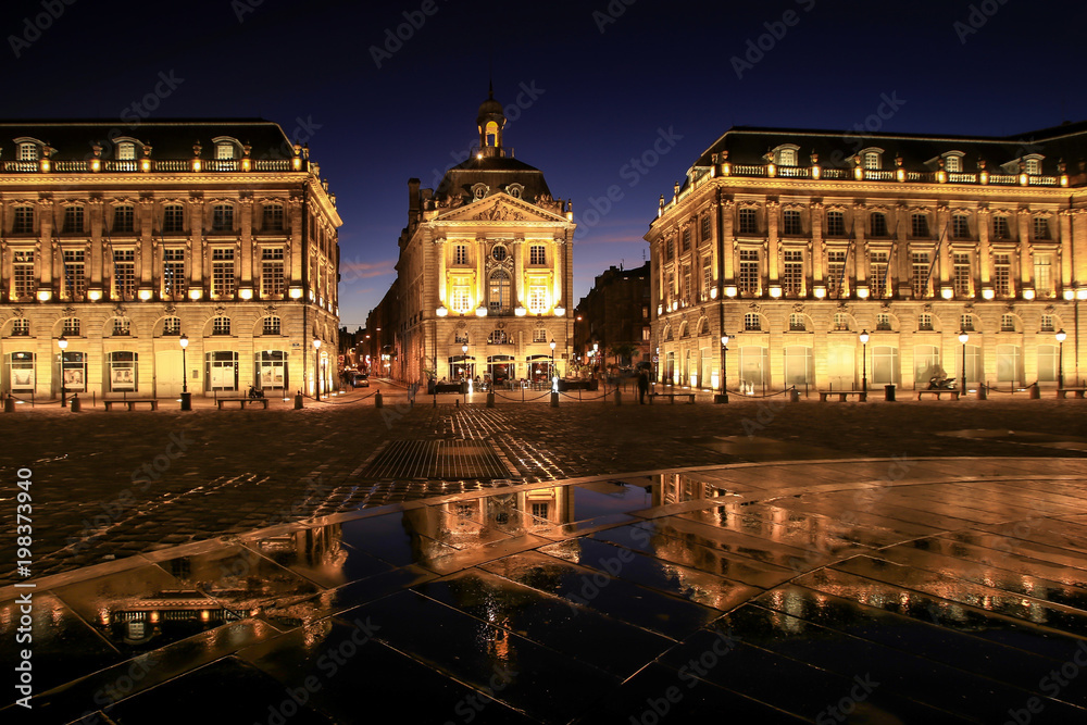 Reflection of Place De La Bourse and colourful sky in Bordeaux, France. A Unesco World Heritage