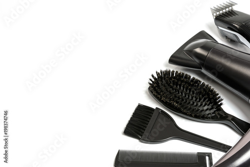 Hairdresser set with various accessories on a white background with copy space