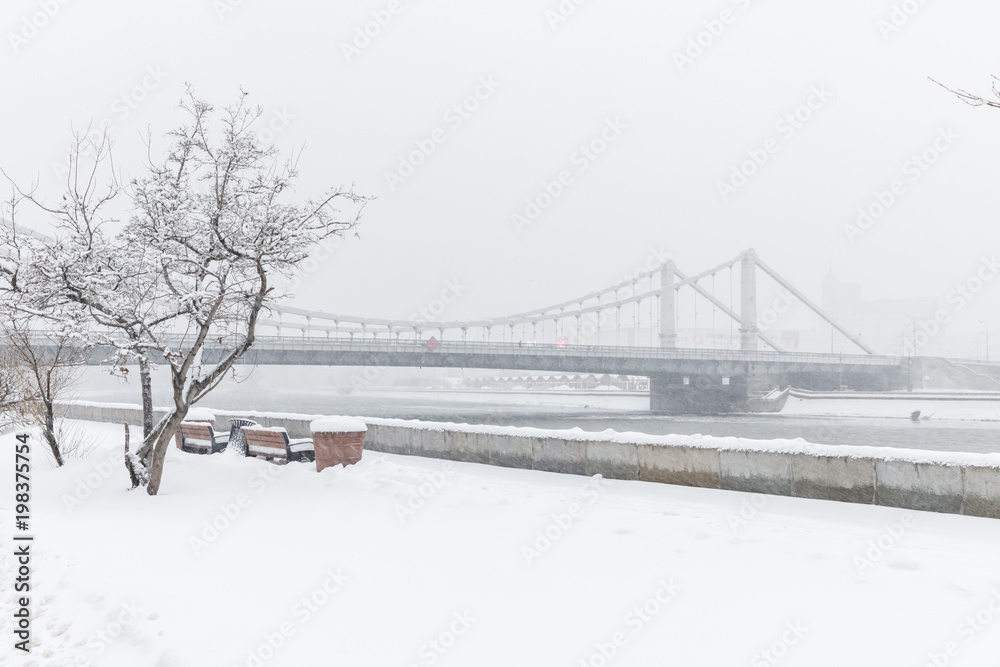 Heavy snowfall in Moscow. Snow-covered roads and Krymsky Bridge. Collapse of public services