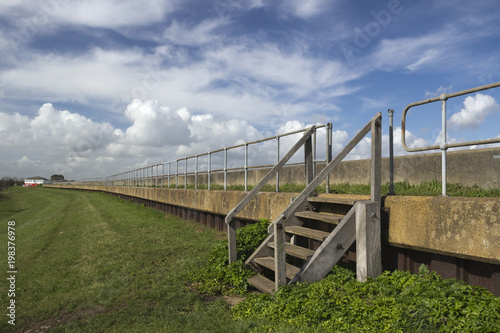 View along the sea wall on Canvey Island, Essex, England